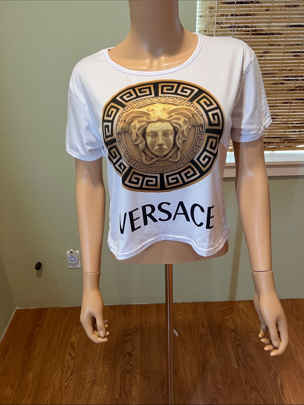 Fashion Inspired White Crop Tee with Gold Medusa Emblem Size L